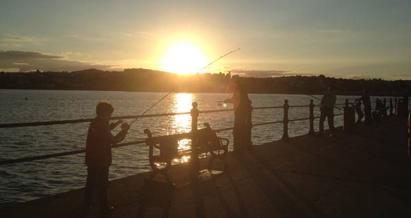 Child fishing at Princess pier.